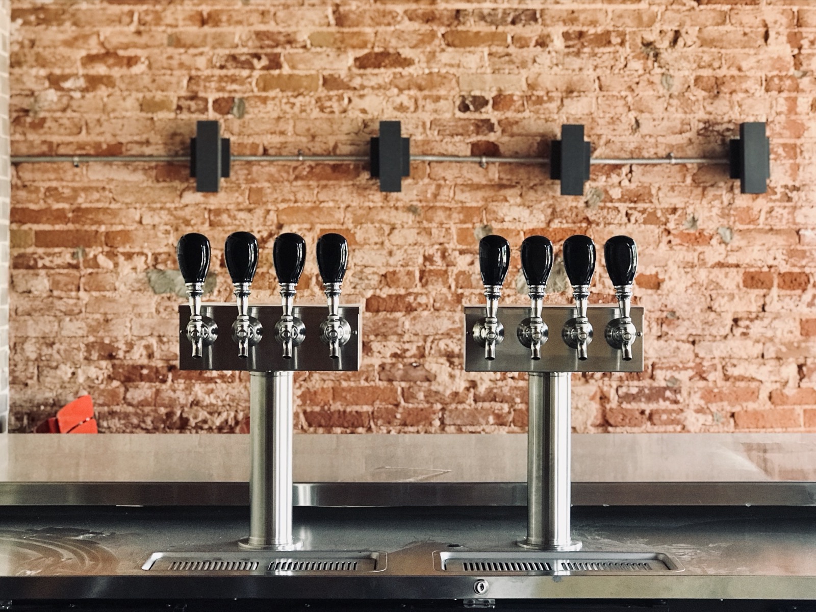 Dual four-tap draft towers on exposed brick